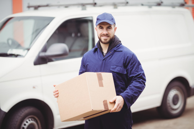 delivery-man-holding-box-front-his-van