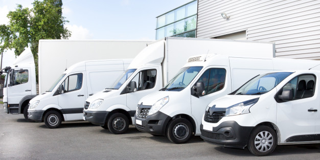 several-vans-trucks-parked-parking-lot-rent